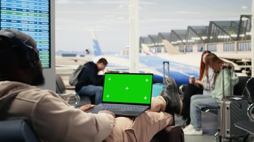 Mockup Screen on Laptop with Traveler Waiting for Boarding Flight in the Airport