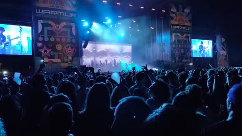 Almaeria, Spain, people crowd dancing in festival, concert of techno music in Spain.