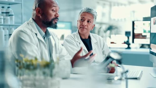 Scientists Analyzing Data in Modern Laboratory