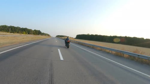 Follow to Biker Riding on Modern Sport Motorbike at Autumn Highway Motorcyclist Racing His