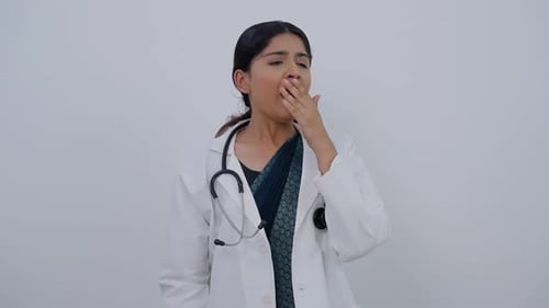 Indian Female Doctor Yawning
