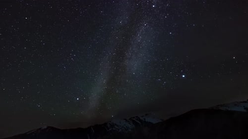 Majestic View of Night Sky Over Mountain Range Filmed From Below in Timelapse