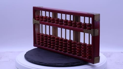 Vintage Red Wooden Abacus Revolves on White Platform