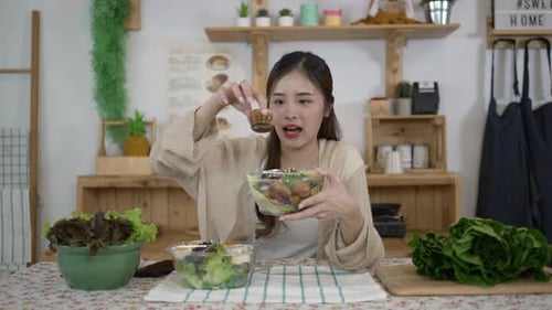 Young Woman Preparing Salad at Home
