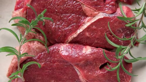 Red Meat Top View Cut Steak is Spinning on Wooden Cutting Board Background Flat Lay Fresh Raw Meat