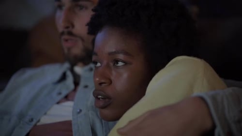 Couple Watching a Scary Movie at Home