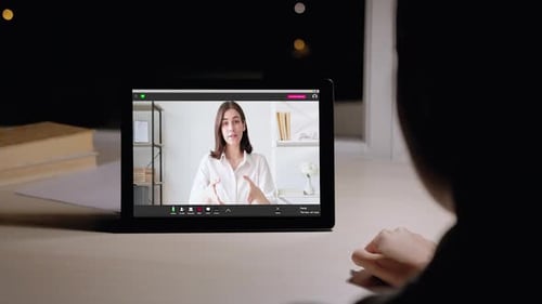 Woman on Tablet Video Call at Night