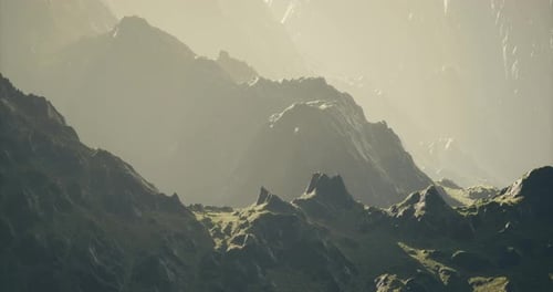 Majestic Mountain Landscape with Sunlit Peaks and Serene Valleys