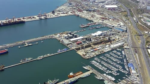 4k drone footage of boats at a seaside harbour