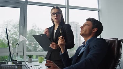 Confident Manager Discussing Assistant Planning Business Schedule Closeup. Beautiful Businesswoma...