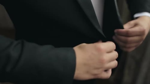 Correct Button on Jacket Hands Closeup Dressing