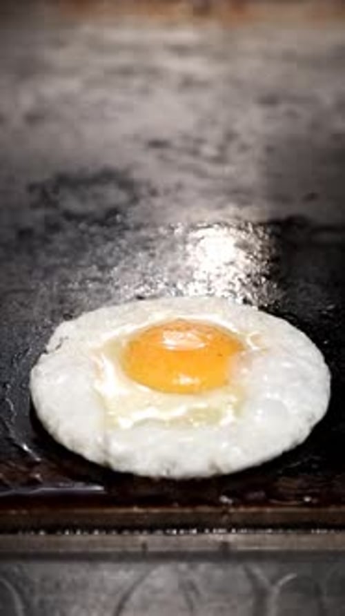 Fried Egg Cooked on Flat Top Grill