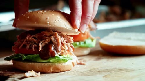 Delicious Pulled Pork Sandwich with Lettuce and Tomato