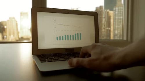 Carefully Analyzing Valuable Data Insights on a Laptop for Business Purposes and Growth