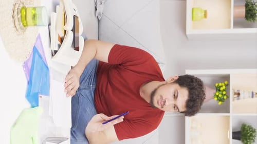 Young Adult Student Studies and Plays Phone Game