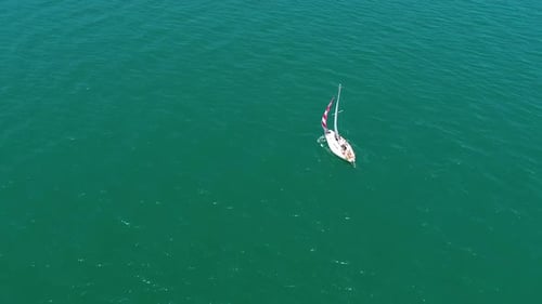 Sailing boat. Yacht sailing on the sea. Boat swimming on beautiful water background.