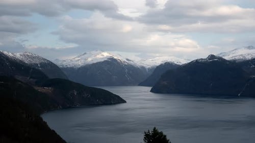 Time lapse of Storfjord, a fjord in Norway with beautiful scenery and the mountains is covered with