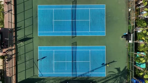 View From Above Aerial View of Two People Playing Tennis on a Blue Court aerIAL VIEW