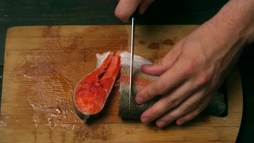 Slicing Fresh Red Fish on Cutting Board