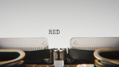 Old mechanical typewriter typing Reduce in a close-up view.