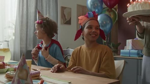 Two Boys Celebrating a Birthday at Home