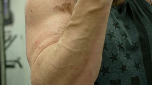 Active Bodybuilder Young Man Lifting Heavy Weights