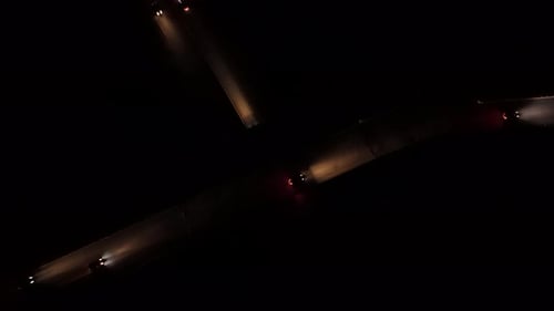Nighttime Aerial Footage Of Dartmouth Junction With Illuminated Car Headlights