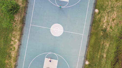 Kids Playing Basketball Aerial Sunset Drone Birds Eye Footage