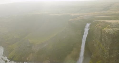 Aerial view of haifoss waterfall in a serene valley, Iceland.