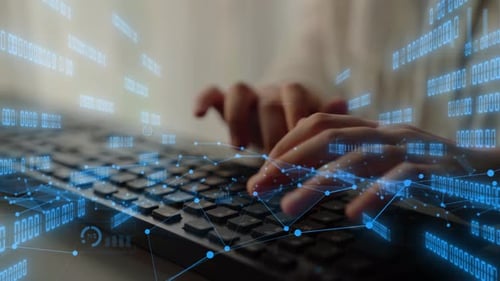 Espace de travail numérique avec saisie manuelle sur le clavier, entouré de visualisations de données et de graphiques Represe