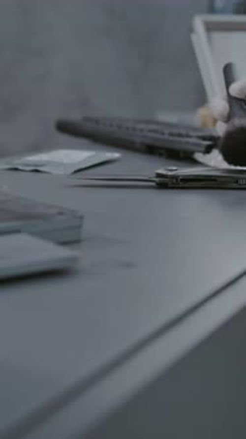 Numbered Marker Stands Next to Crime Scene Evidence Close Up of Criminalist Searching Fingerprints
