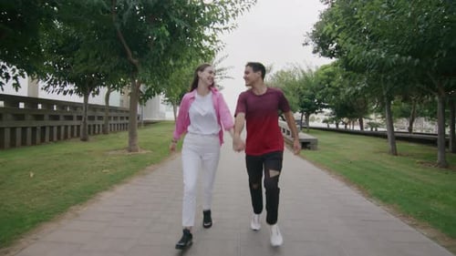 Park Running Cute Young Teen Caucasian Couple in City Green Park