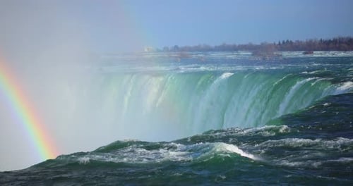 4k niagria falls mist cloud waterfall gulls water flowing over edge rainbow