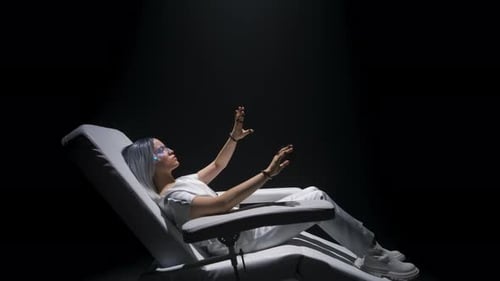 Woman in VR Headset Reclining and Interacting