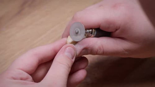 Dental Drill Sculpting and Refining Artificial Teeth