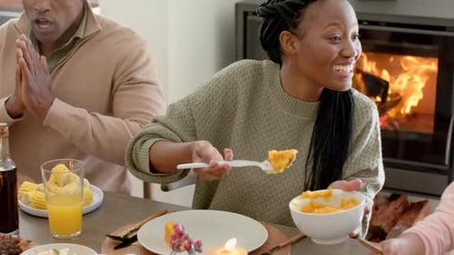 Family Sharing Thanksgiving Meal Together at Home