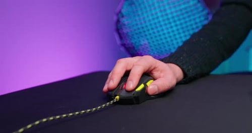 Hand Using Computer Mouse on a Desk