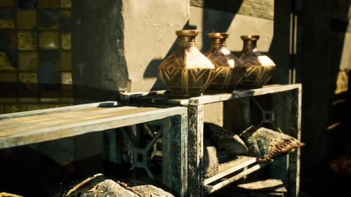 Handcrafted Brass Urns with Embossed Patterns in Sunny Market Stall