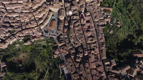 Aerial view of medieval rooftops and architecture, Italy.