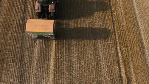 Aerial View of Farmer Fertilizing Agricultural Field Spreading Mineral Fertilizer in Slow Motion