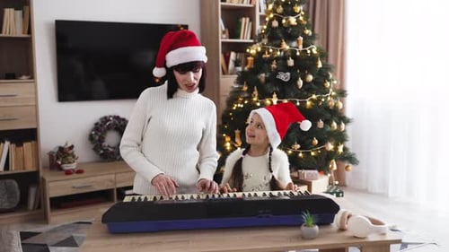 Festive Mother and Child Playing Piano at Christmas