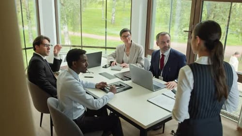 Business Professionals Meeting in Modern Conference Room