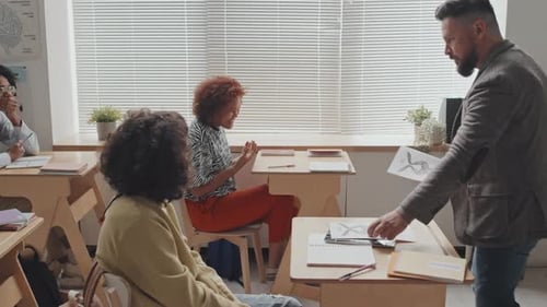Students Receive Artwork in a Classroom Setting