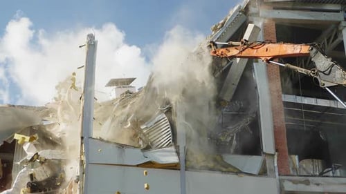 Excavator Cuts Support to Destroy Hockey Stadium Building