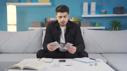 Stressed college student unhappy and depressed due to financial difficulties.