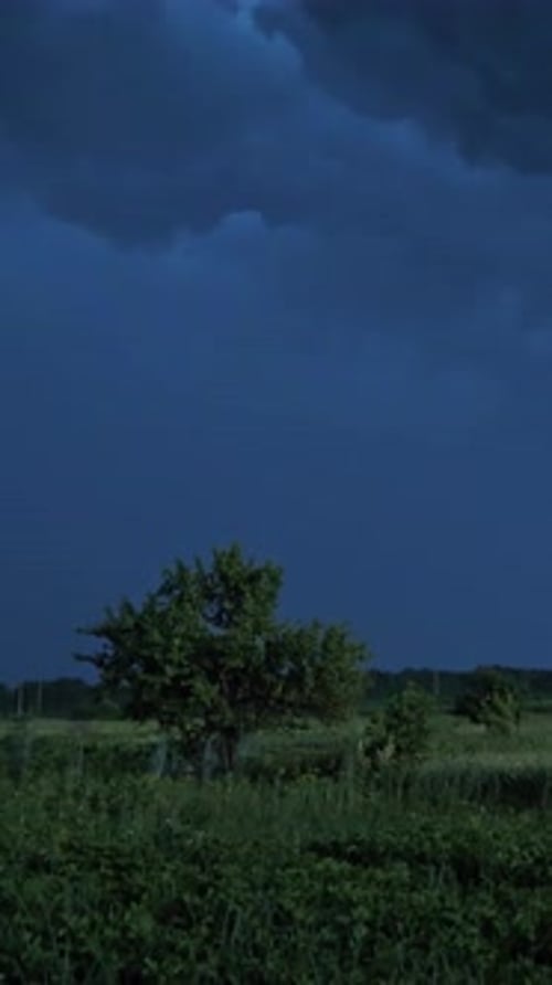 Dramatic Lightning Over a Dark Rural Landscape