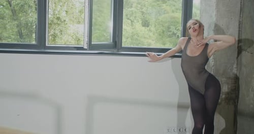 Fit Young Woman is Dancing in the Studio Professional Dancer Sports