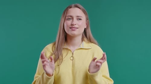 Young Woman Crossing Fingers Hoping For Good Luck