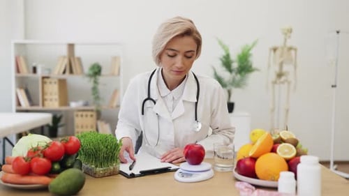 Woman Weighs Red Apple at Doctor's Office