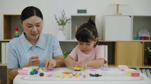 Woman and Girl Play with Colorful Modeling Clay